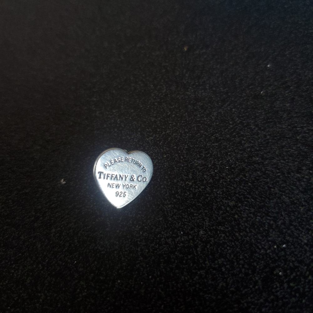Single "Return to Tiffany" Sterling Silver earring.